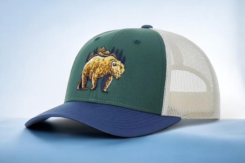 115 green trucker hat with bear on the logo