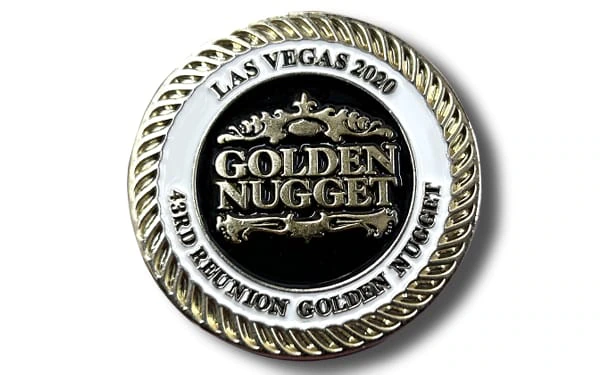 Gold and black commemorative coin for the Golden Nugget 43rd Reunion in Las Vegas, 2020. The coin features raised gold lettering, a black enamel center, a white enamel outer ring with embossed text, and a decorative gold rope border.