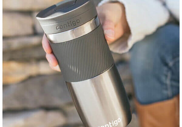 man holding travel mug