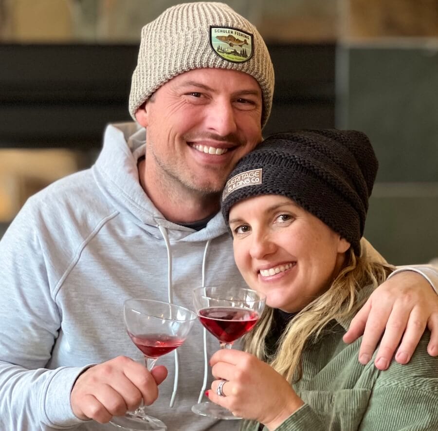 couple holding wine glasses