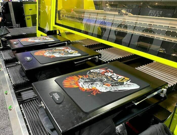 Close-up of digital printing process on fabric, showcasing vibrant colors and high-detail customization, representing modern printing techniques and custom apparel design.