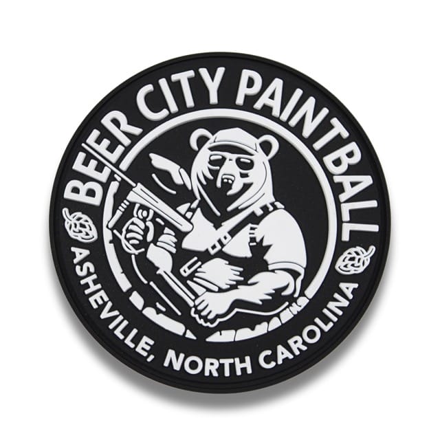 Custom black and white paintball patch with a bear