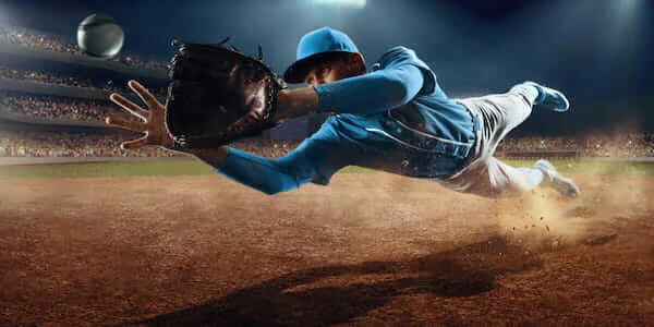 baseball player with hat catching a ball