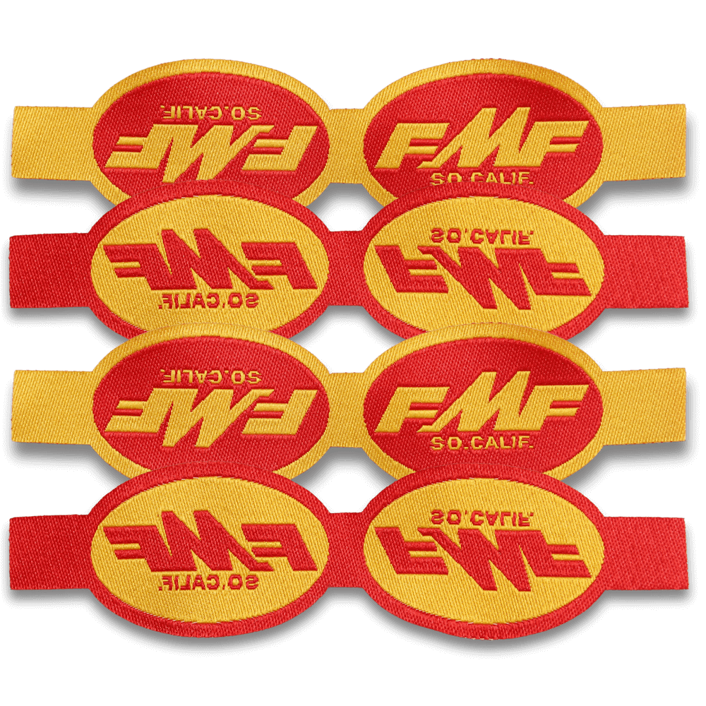 red and yellow woven labels laying flat