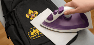 ironing patch onto backpack