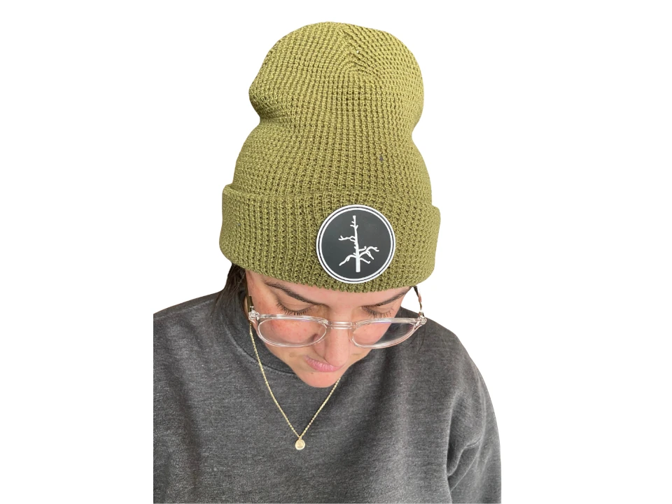 person wearing beanie with black PVC Patch