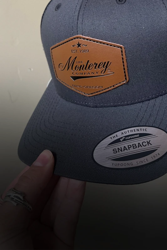 Monterey Company leather patch hat with engraved logo